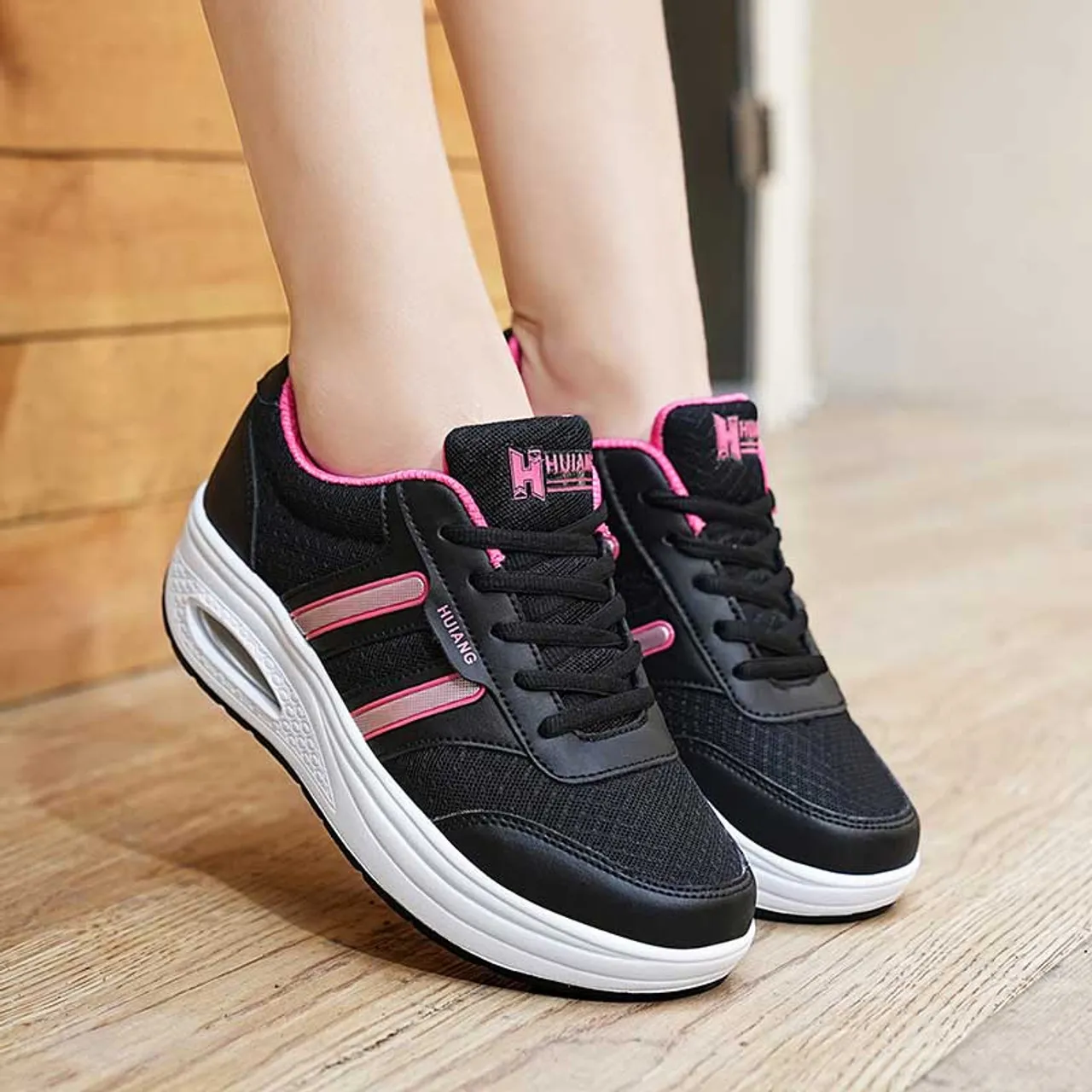 Black stripe accents rocker bottom shoe sneaker